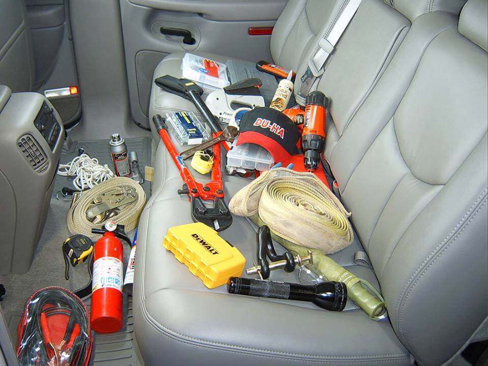 Work tools and other items on back seat of car