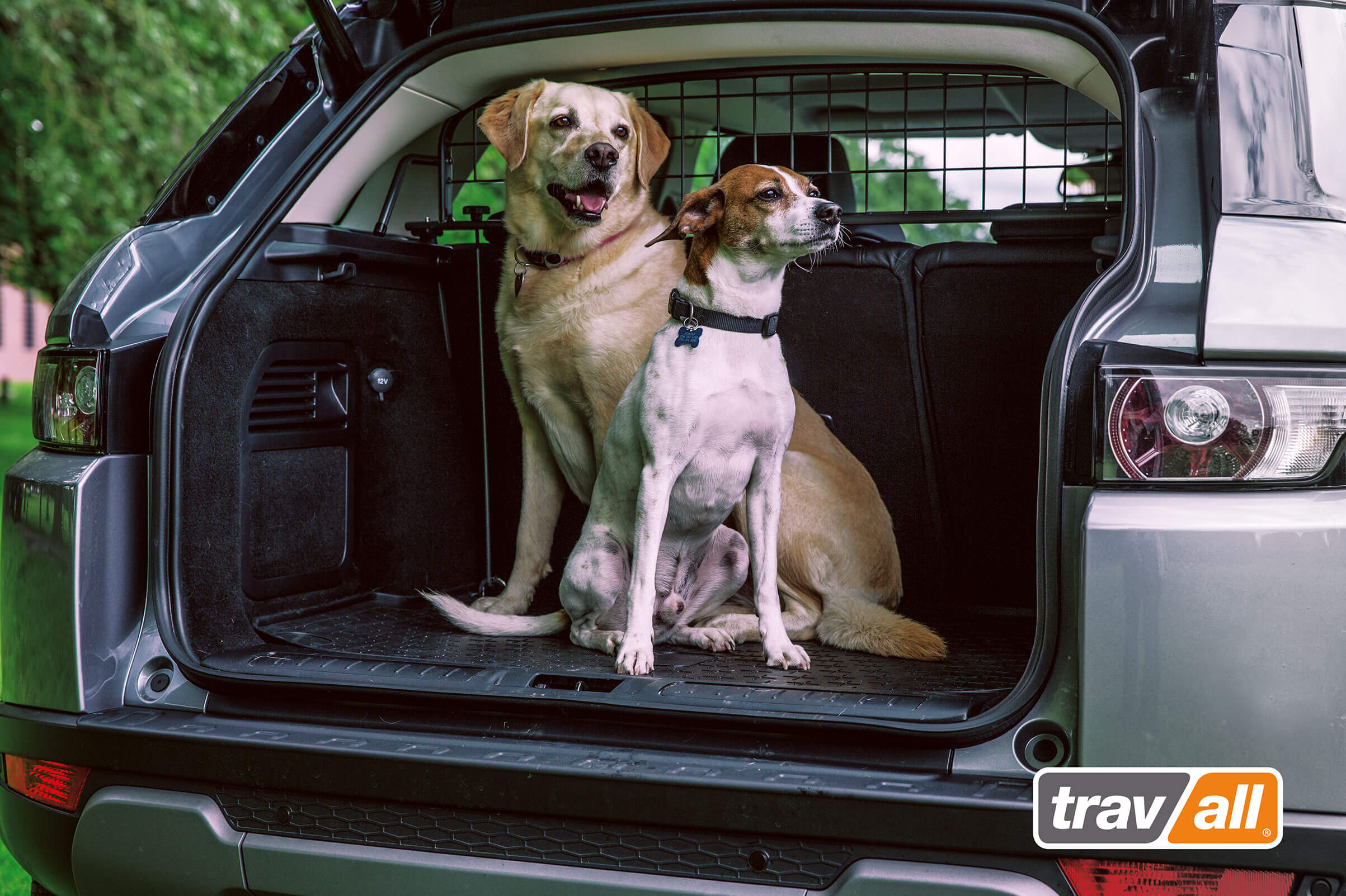 The safety of our pet passengers is an important topic here at Travall. Many of us have our own furry family members and we know that our customers have pets as our Travall Guard can be purchased as a protective car accessory. Tomorrow, January 2, is Pet Passenger Safety Day and in honor of this day we’ve pulled together a list for pet passenger safety, some of these tips are for people who don’t currently use a Travall Guard. Passenger side only When you’re walking your dog to get in the car and you park on the street, make sure you enter on the passenger side of the vehicle. The same goes for exiting. You want to make sure they aren’t getting in and out of the car on the side that faces traffic. No lap dogs! It’s not safe to drive with your pet on your lap. Even having them riding in the front seat is dangerous for them. In the event of an accident or sudden stop, they could be injured by the passenger airbag, ejected through the windshield or could distract you from driving by asking for attention or moving around the car. Be cautious of electric windows If you open the window for your dog to put their nose or head out always remember to put on the window locks! Your dog could move their feet and accidentally close the window on themselves which would cause injury or worse. I can’t be more serious about this, as I’ve had a window start rolling up on my dog and it’s quite scary! Secure your woof One of the most important things to do when traveling in the car with your pet is to secure your dog. Whether that’s with a doggy seatbelt harness, a dog crate or a pet barrier, you’ll be happy that you did if the unthinkable happens. We, of course, suggest a Travall Guard. They’re vehicle specific, quick and easy to install and have a Limited Lifetime Warranty. So not only will they last for the life of your vehicle, you’ll be able to install yours at home with your own two hands. This January, and every other month, remember to take make all the right choices for protecting your pet in and out of your home. They’ll love you even more for it. 